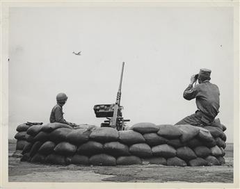 (VIETNAM WAR) Binder of approximately 96 press photographs taken in Vietnam, including photographs by Henri Huet and Charles Eggleston.